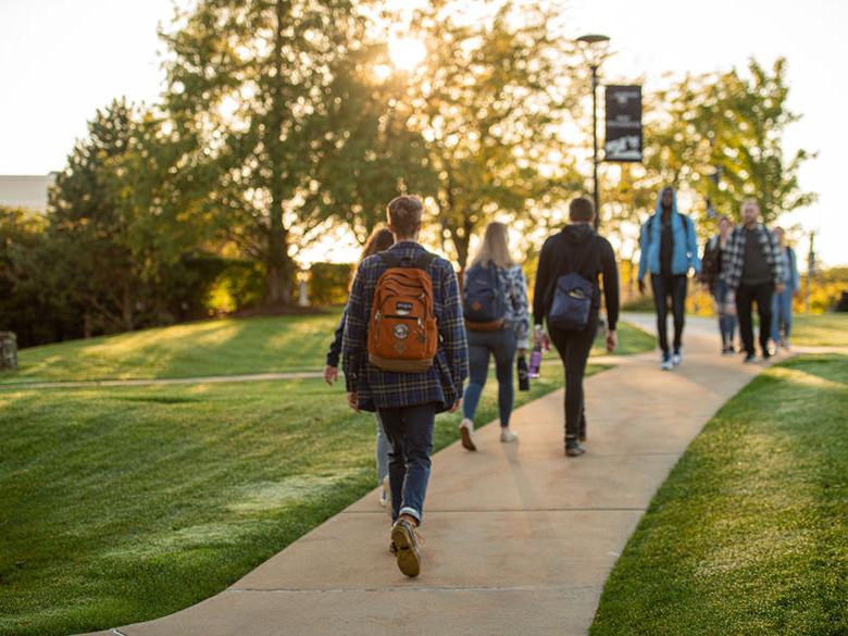 Photo of students walking on campus